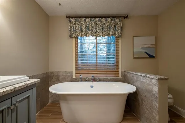 a bathroom with a bathtub and a sink