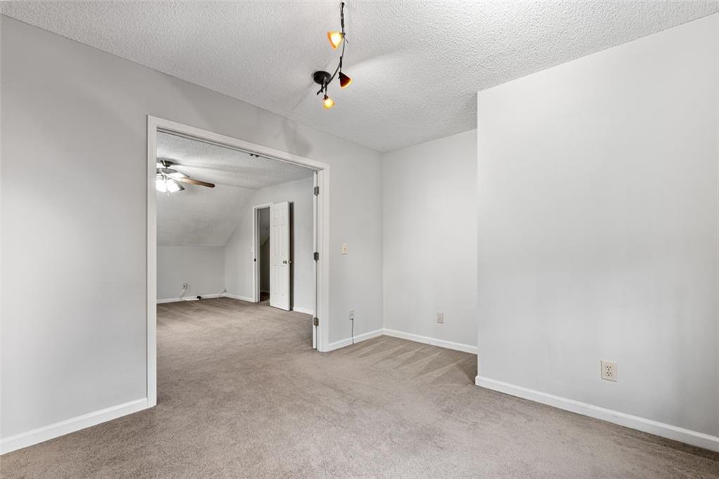 4803 Tarleton Drive Southwest Lilburn, GA 30047 - Photo 23 of 32 an empty room with a bathroom