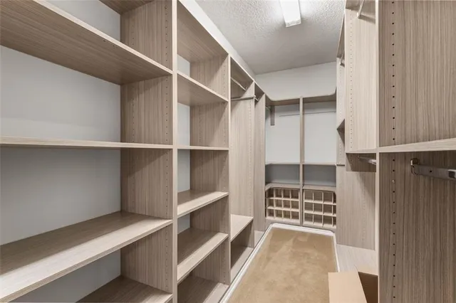 a view of an empty room with empty shelves