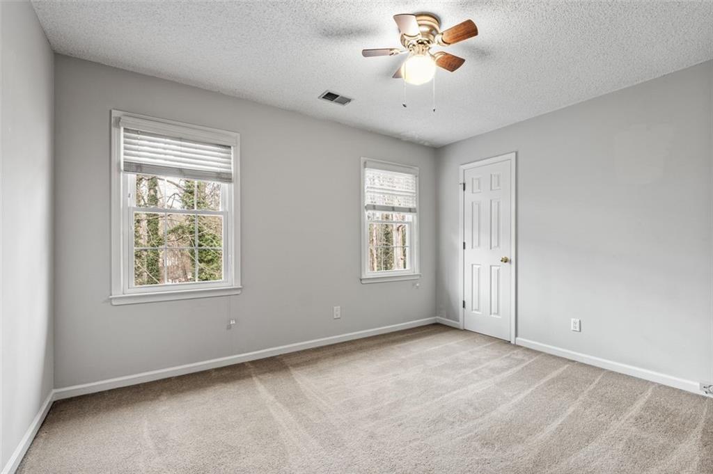 4803 Tarleton Drive Southwest Lilburn, GA 30047 - Photo 24 of 32 a view of an empty room with a window