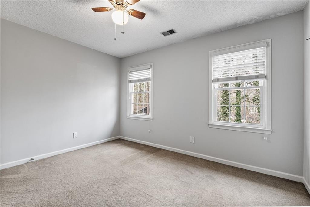 4803 Tarleton Drive Southwest Lilburn, GA 30047 - Photo 25 of 32 a view of an empty room with a window