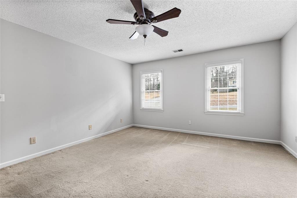 4803 Tarleton Drive Southwest Lilburn, GA 30047 - Photo 26 of 32 a view of an empty room with a window
