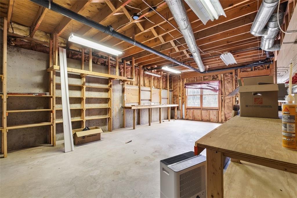 4803 Tarleton Drive Southwest Lilburn, GA 30047 - Photo 28 of 32 a view of an empty room with a fireplace