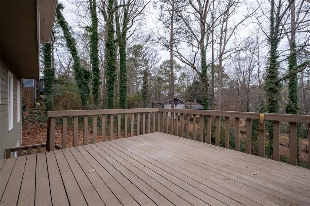 4803 Tarleton Drive Southwest Lilburn, GA 30047 - Photo 31 of 32 a balcony with wooden floor and fence