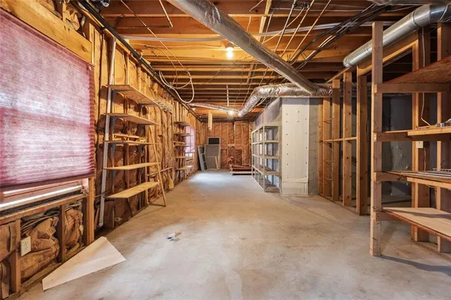 a view of an empty room with storage