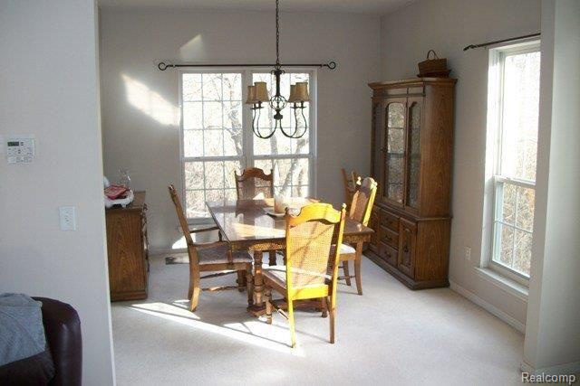 6006 Ravine Court Clarkston, MI 48348 - Photo 8 of 20 Dining room overlooks woods