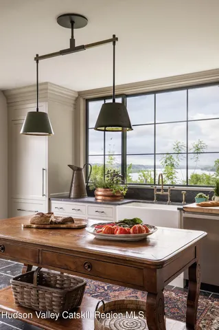 a living room with a table and window