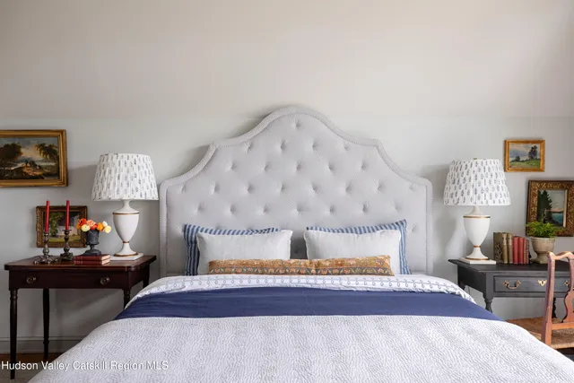 a bedroom with bed and window