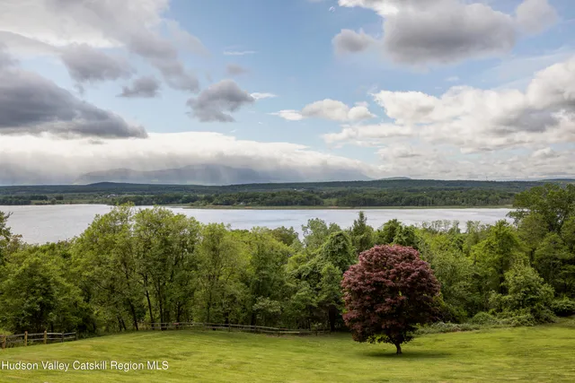 a view of a lake with a big yard