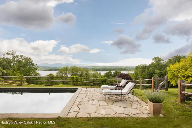 a view of a lake with furniture