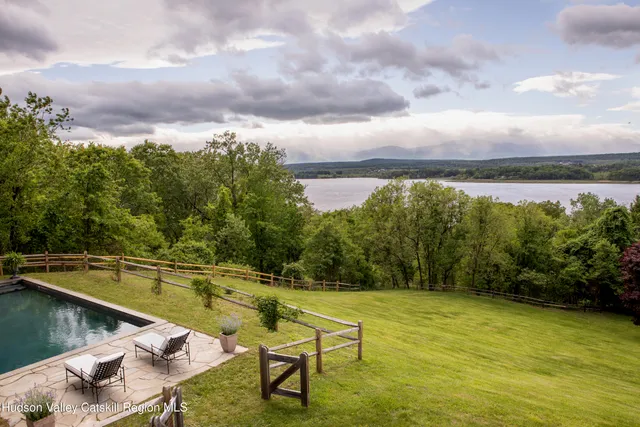 a view of a swimming pool with a yard