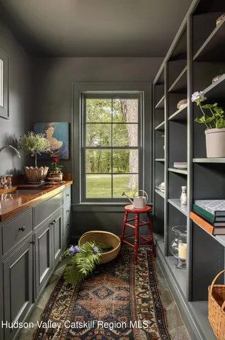 a view of a house with backyard sitting area and garden