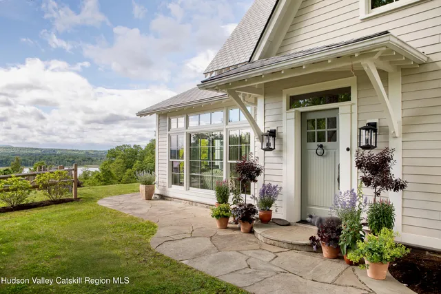 a view of a patio with a table and chairs
