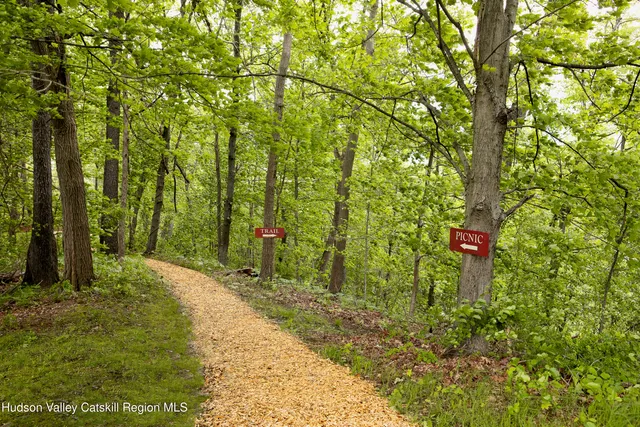 a view of balcony with deck and trees
