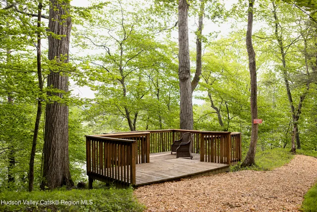 a view of residential houses with yard and swimming pool