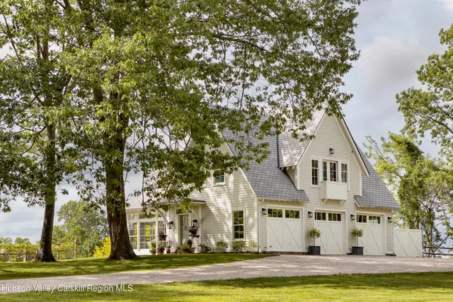 a view of a lake with houses in the back