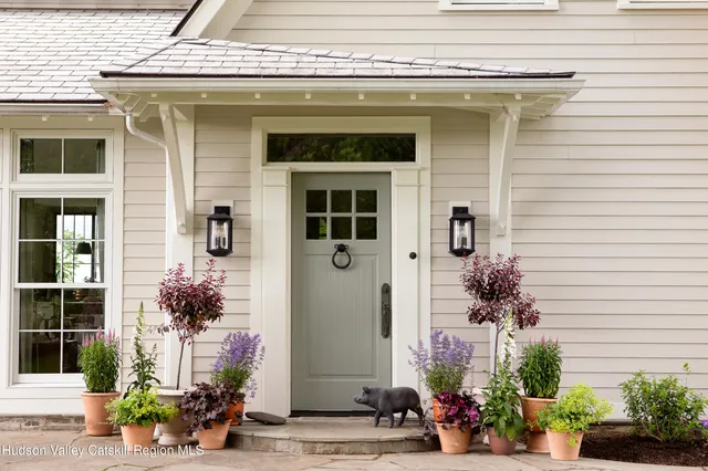 a front view of a house with a porch