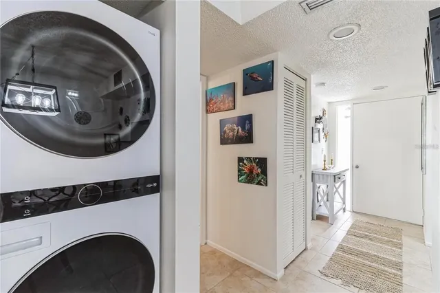 a view of backyard with potted plants and wooden fence