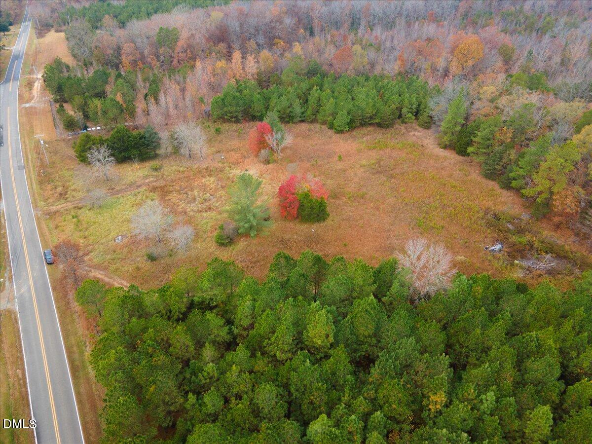1923 Lawson Chapel Church Road Roxboro, NC 27574 - Photo 13 of 19 a backyard of a house with lots of green space