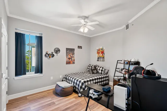 a dining room with furniture and wooden floor