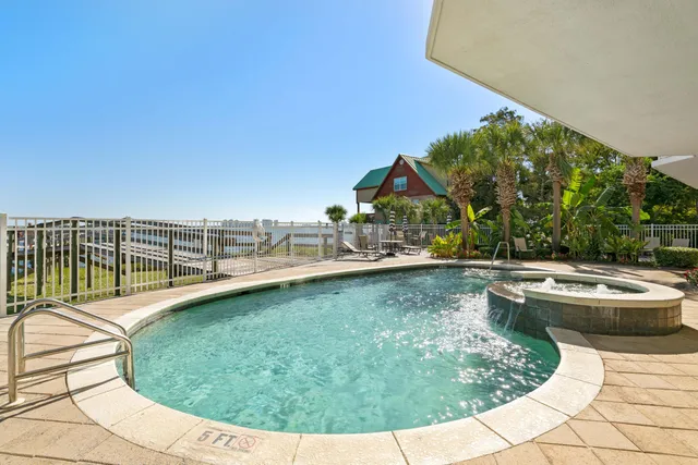 a view of swimming pool having outdoor seating