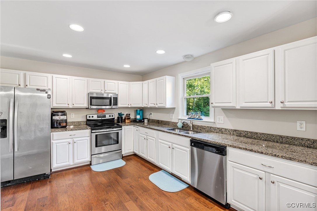11925 Belfonte Road Bumpass, VA 23024 - Photo 12 of 34 a kitchen with granite countertop a sink a counter space stainless steel appliances and cabinets