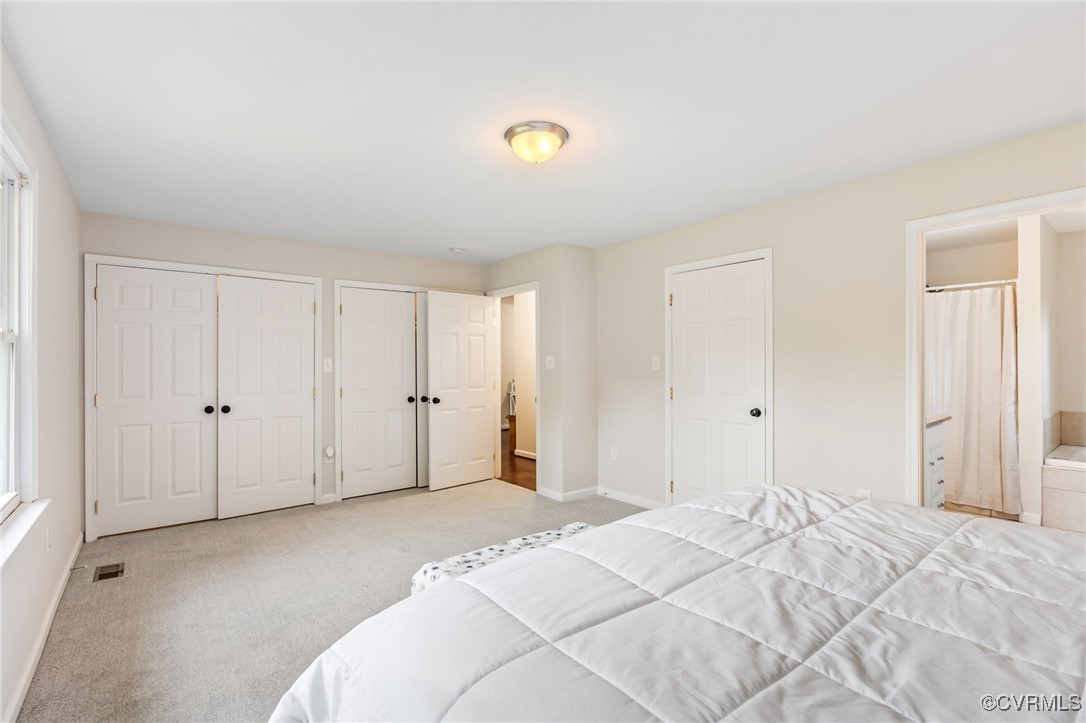 11925 Belfonte Road Bumpass, VA 23024 - Photo 17 of 34 a bedroom with a bed and a window