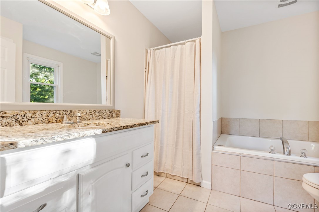 11925 Belfonte Road Bumpass, VA 23024 - Photo 18 of 34 a bathroom with a sink and a bathtub
