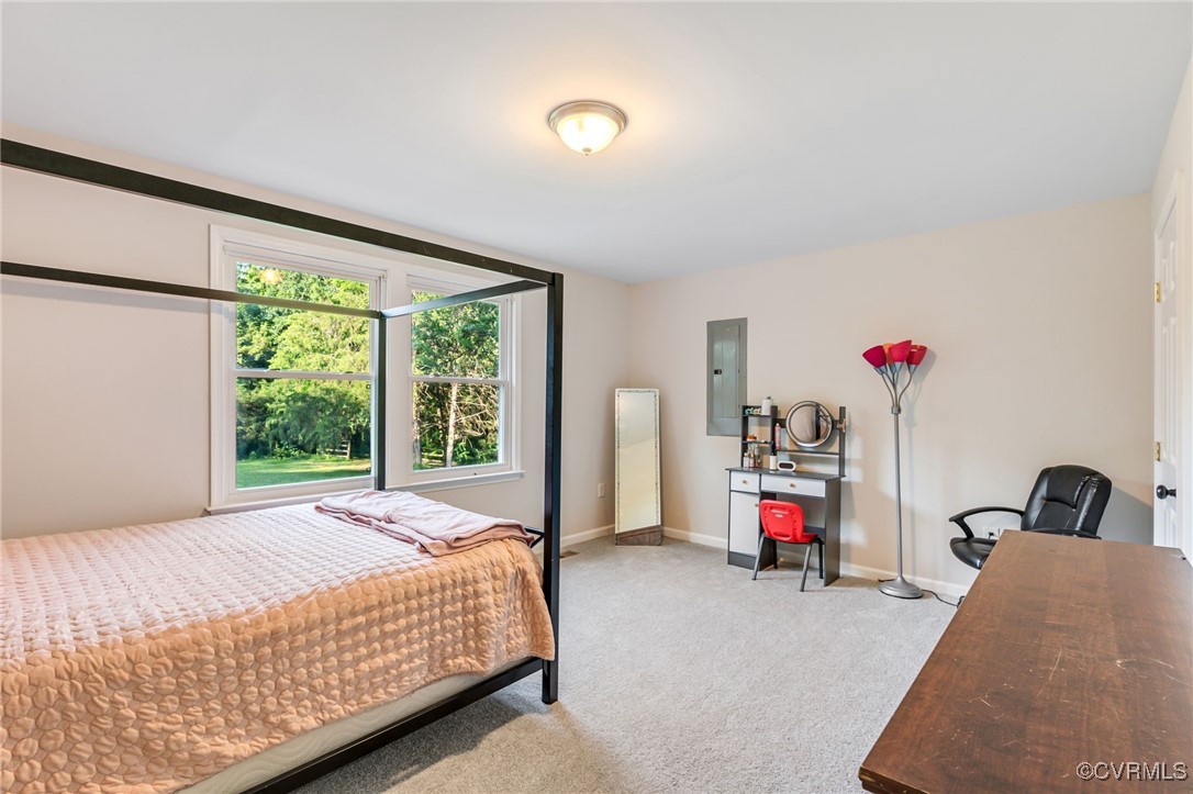 11925 Belfonte Road Bumpass, VA 23024 - Photo 21 of 34 a bedroom with a bed and a large window with the outer view