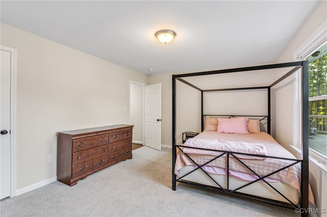 11925 Belfonte Road Bumpass, VA 23024 - Photo 23 of 34 a bedroom with a bed and a dresser