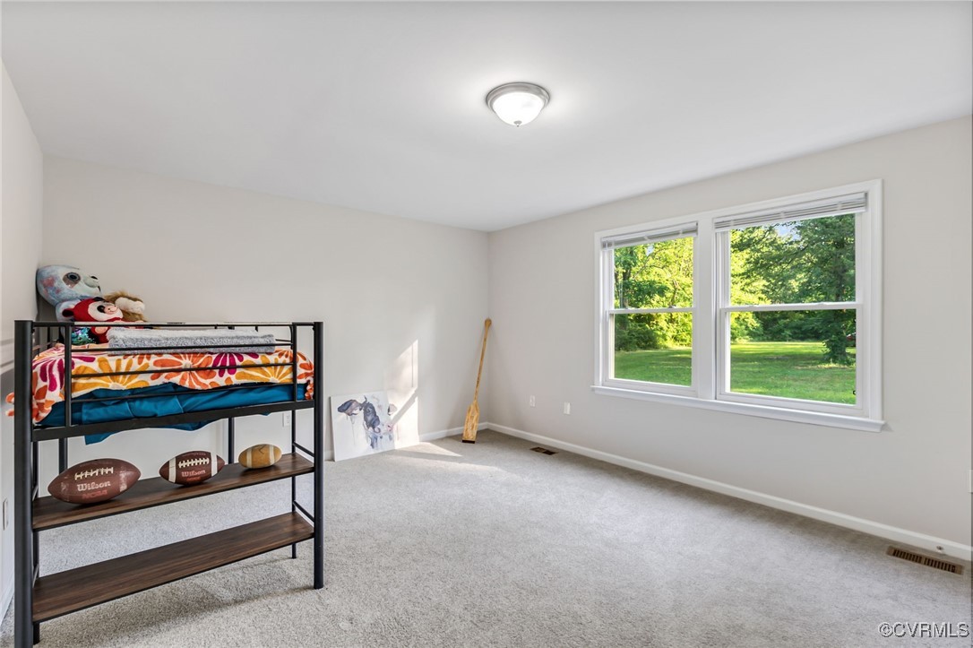 11925 Belfonte Road Bumpass, VA 23024 - Photo 24 of 34 a bedroom with furniture and a window