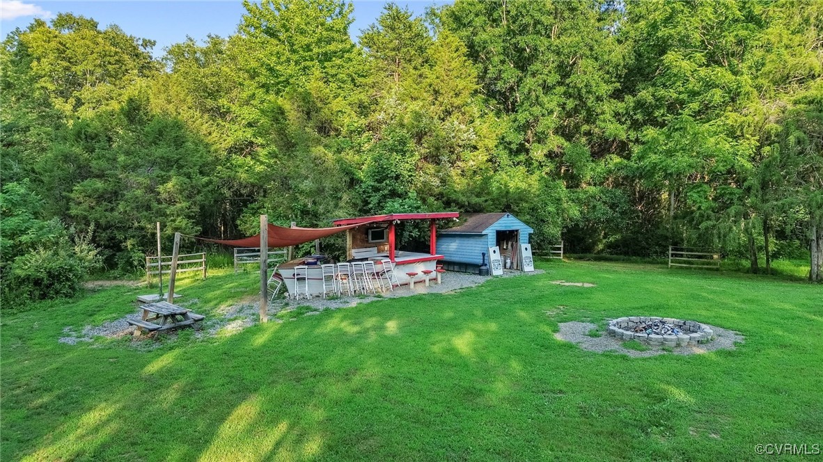 11925 Belfonte Road Bumpass, VA 23024 - Photo 32 of 34 a view of a house with a backyard