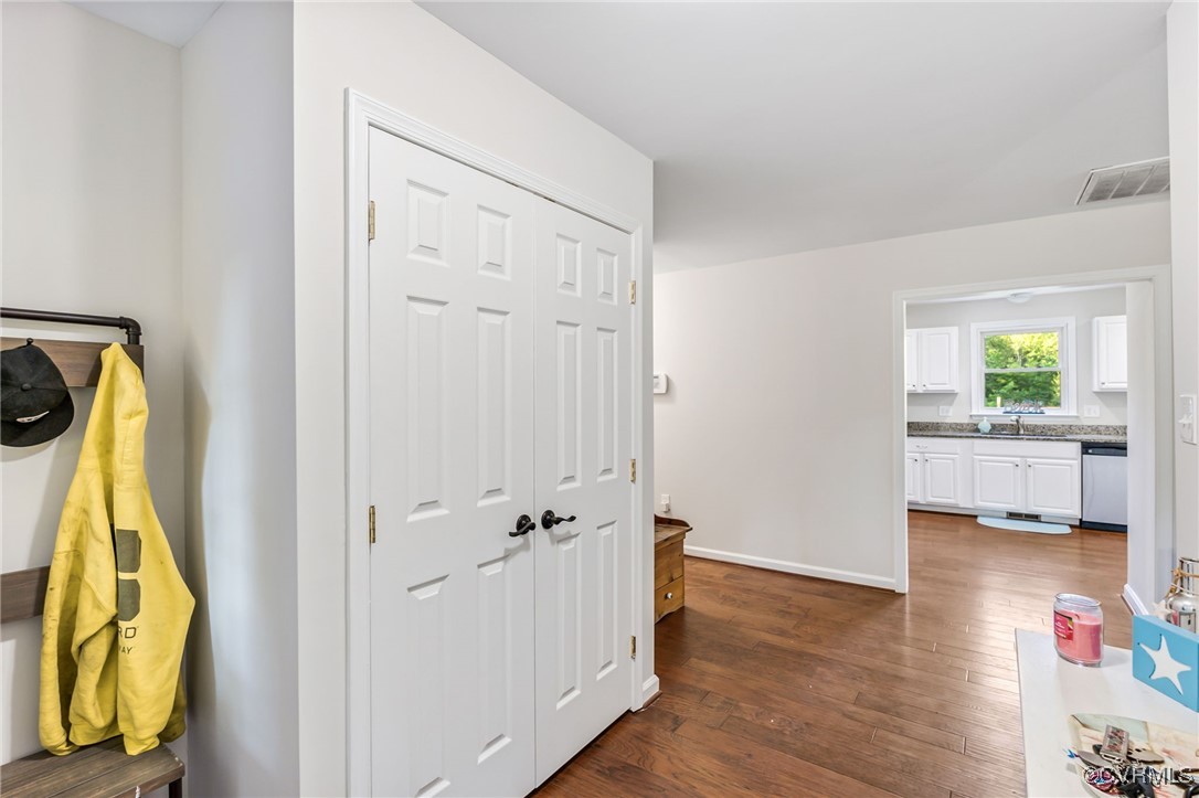 11925 Belfonte Road Bumpass, VA 23024 - Photo 4 of 34 a view of a bathroom with a tub and a hallway
