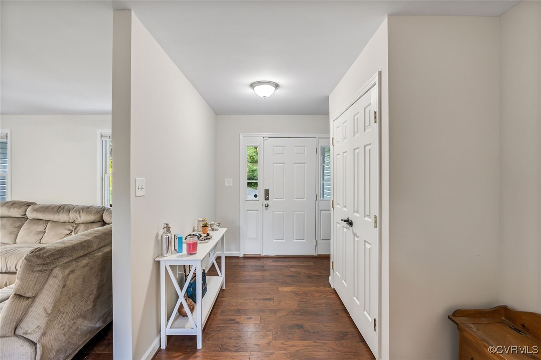 11925 Belfonte Road Bumpass, VA 23024 - Photo 5 of 34 a view of a hallway with furniture and wooden floor