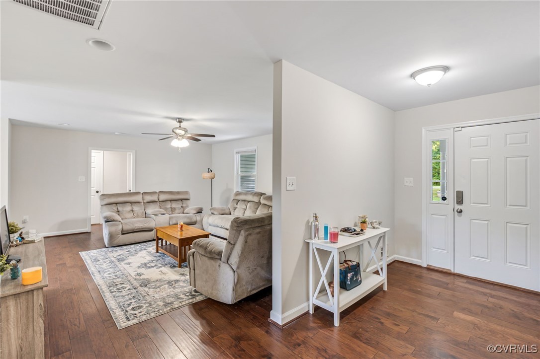 11925 Belfonte Road Bumpass, VA 23024 - Photo 6 of 34 a living room with furniture and a wooden floor