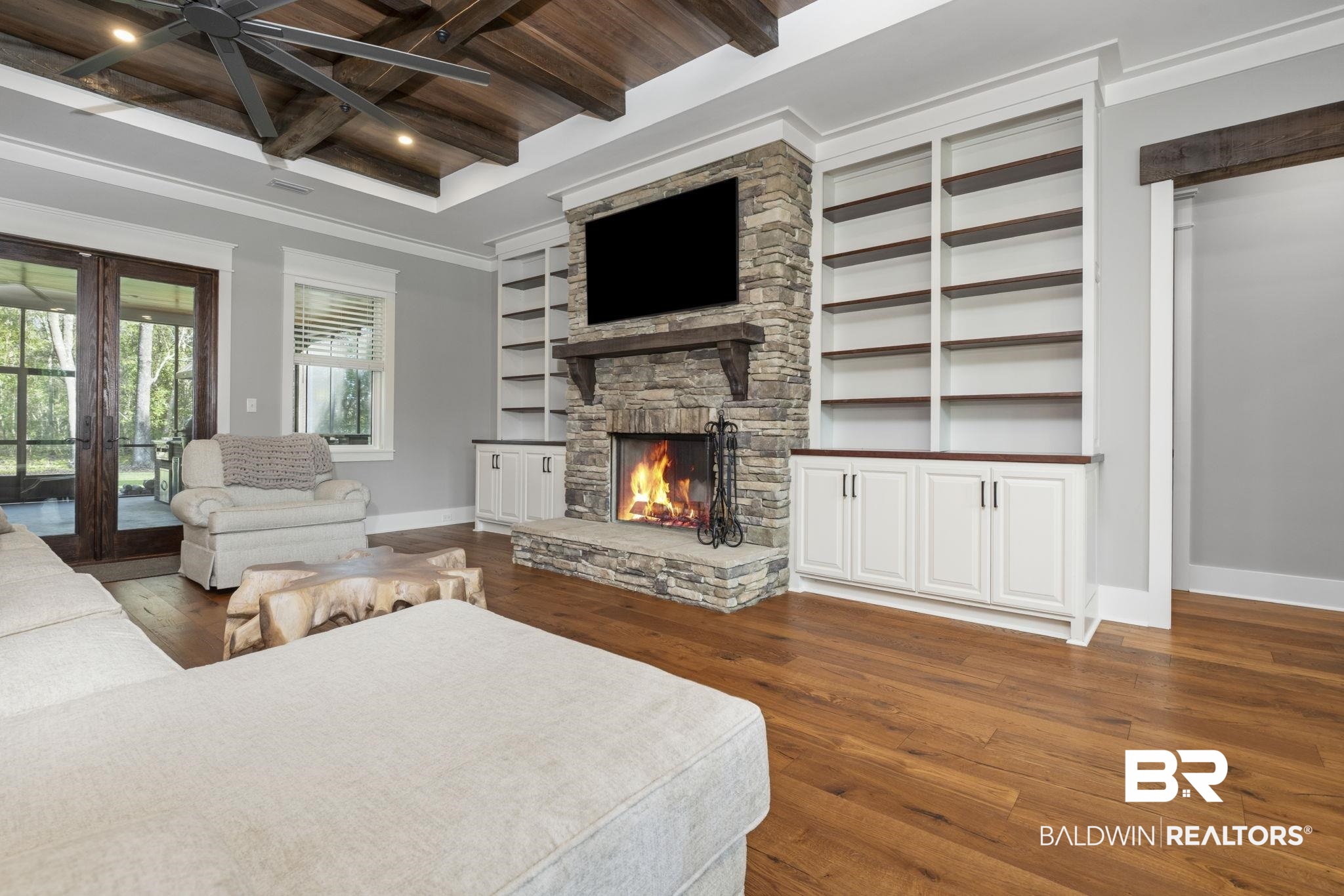 9501 Ben Hamilton Road Theodore, AL 36582 - Photo 12 of 69 Bedroom with dark wood-style floors, access to exterior, a fireplace, french doors, and recessed lighting