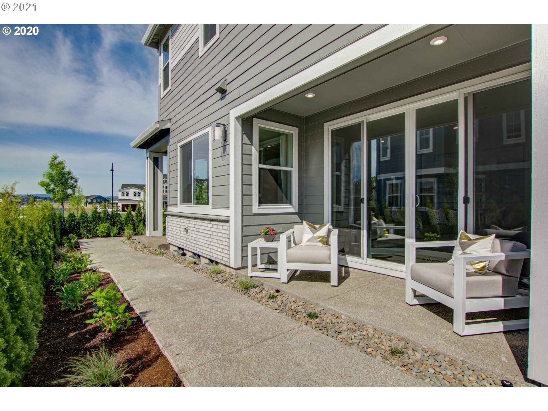 8229 Southeast Kinnaman Road Hillsboro, OR 97123 - Photo 12 of 21 a backyard of a house with wooden floor and outdoor seating