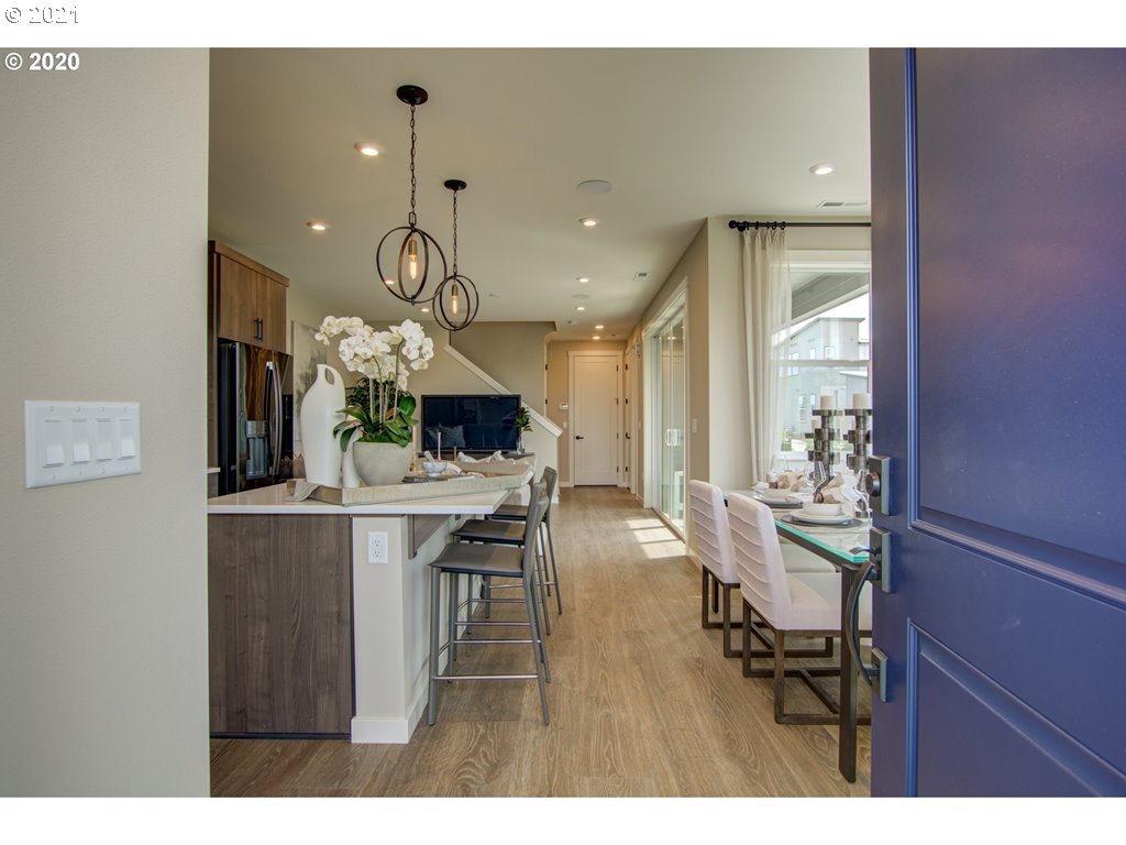 8229 Southeast Kinnaman Road Hillsboro, OR 97123 - Photo 13 of 21 a view of a dining room with furniture and wooden floor