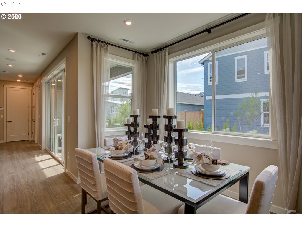 8229 Southeast Kinnaman Road Hillsboro, OR 97123 - Photo 14 of 21 a view of a dining room with furniture window and wooden floor