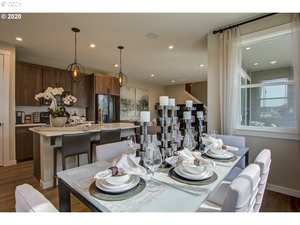 8229 Southeast Kinnaman Road Hillsboro, OR 97123 - Photo 15 of 21 a dining room with furniture a window and kitchen view