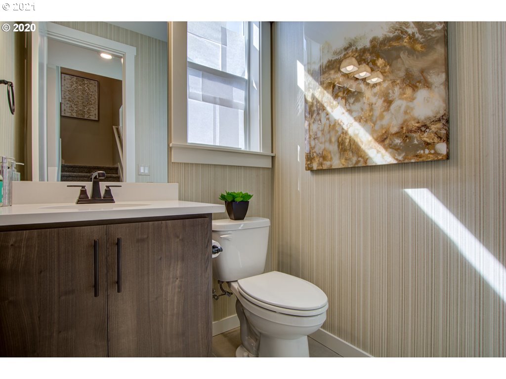 8229 Southeast Kinnaman Road Hillsboro, OR 97123 - Photo 17 of 21 a bathroom with a toilet sink and mirror