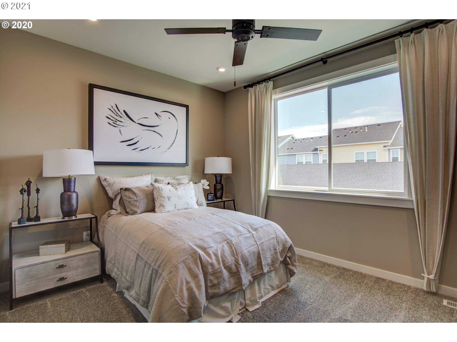 8229 Southeast Kinnaman Road Hillsboro, OR 97123 - Photo 9 of 21 a bedroom with a large bed and a window