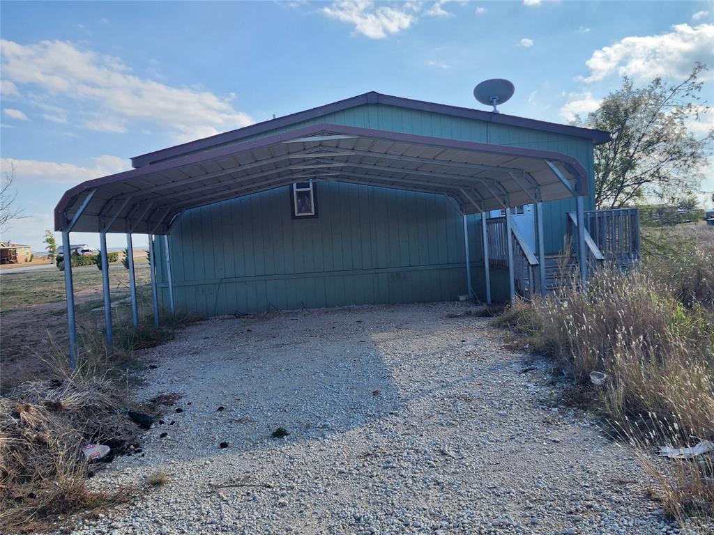 10279 Private Road 6055 Hawley, TX 79525 - Photo 4 of 9 a front view of a house with garden
