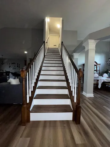 a view of living room with furniture and wooden floor