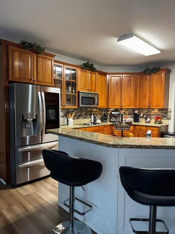a bathroom with a sink vanity and toilet