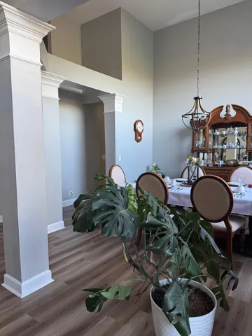 a living room with furniture a rug and a window