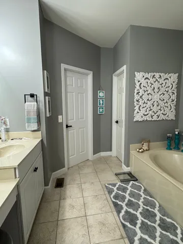 a view of a backyard with sitting area and garden