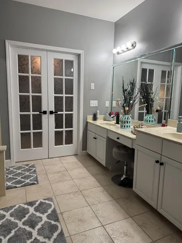 a bathroom with a sink and a mirror