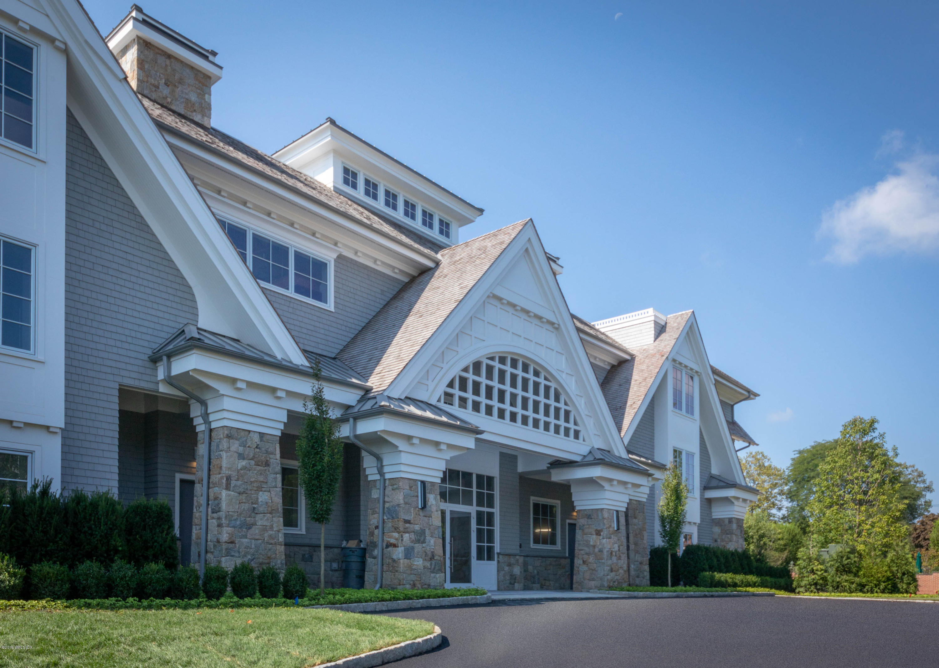 70 Sound View Drive, Unit PH WEST Greenwich, CT 06830 - Photo 15 of 16 front view of a building with a garden