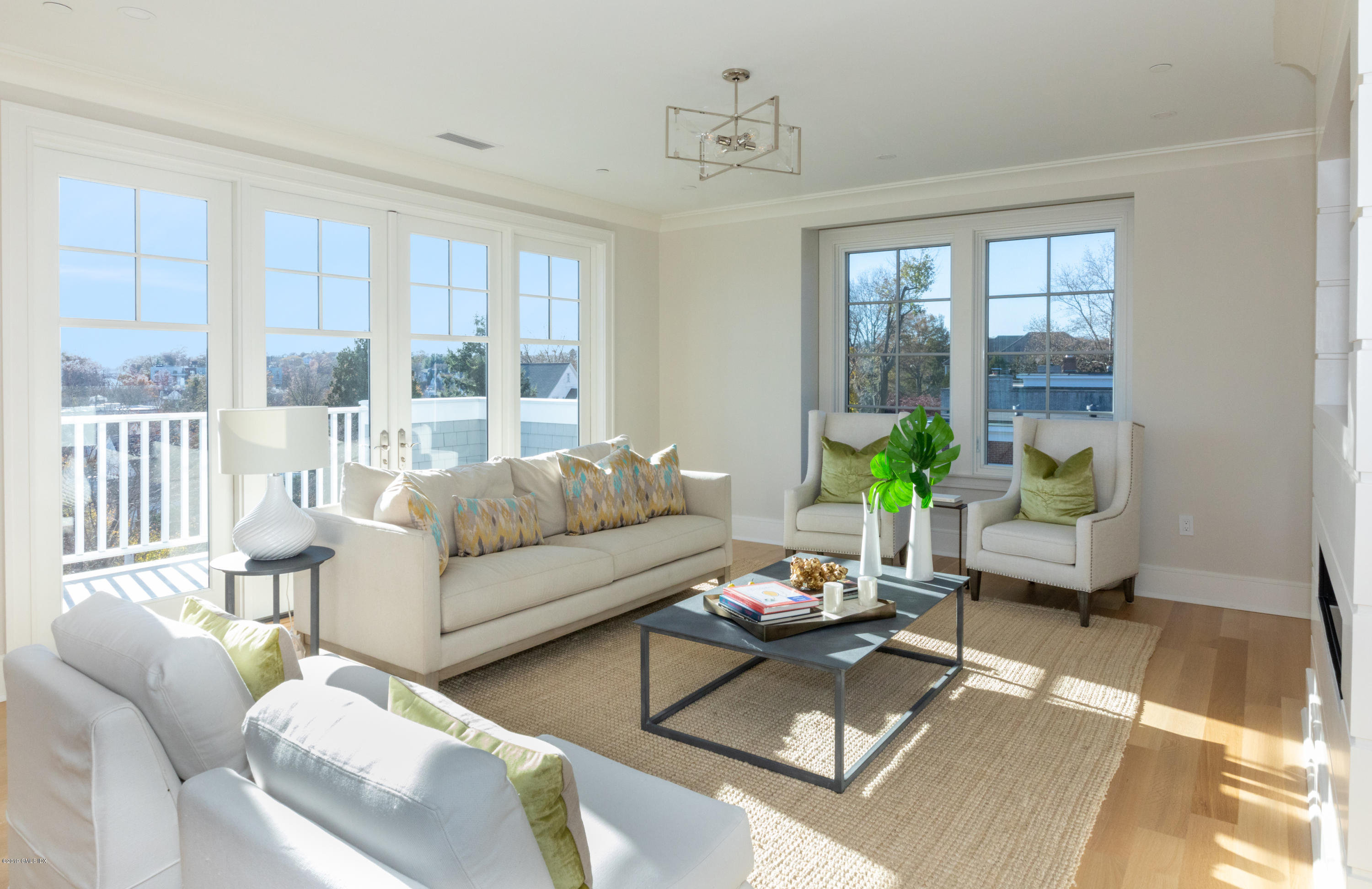 70 Sound View Drive, Unit PH WEST Greenwich, CT 06830 - Photo 3 of 16 a living room with furniture and a large window